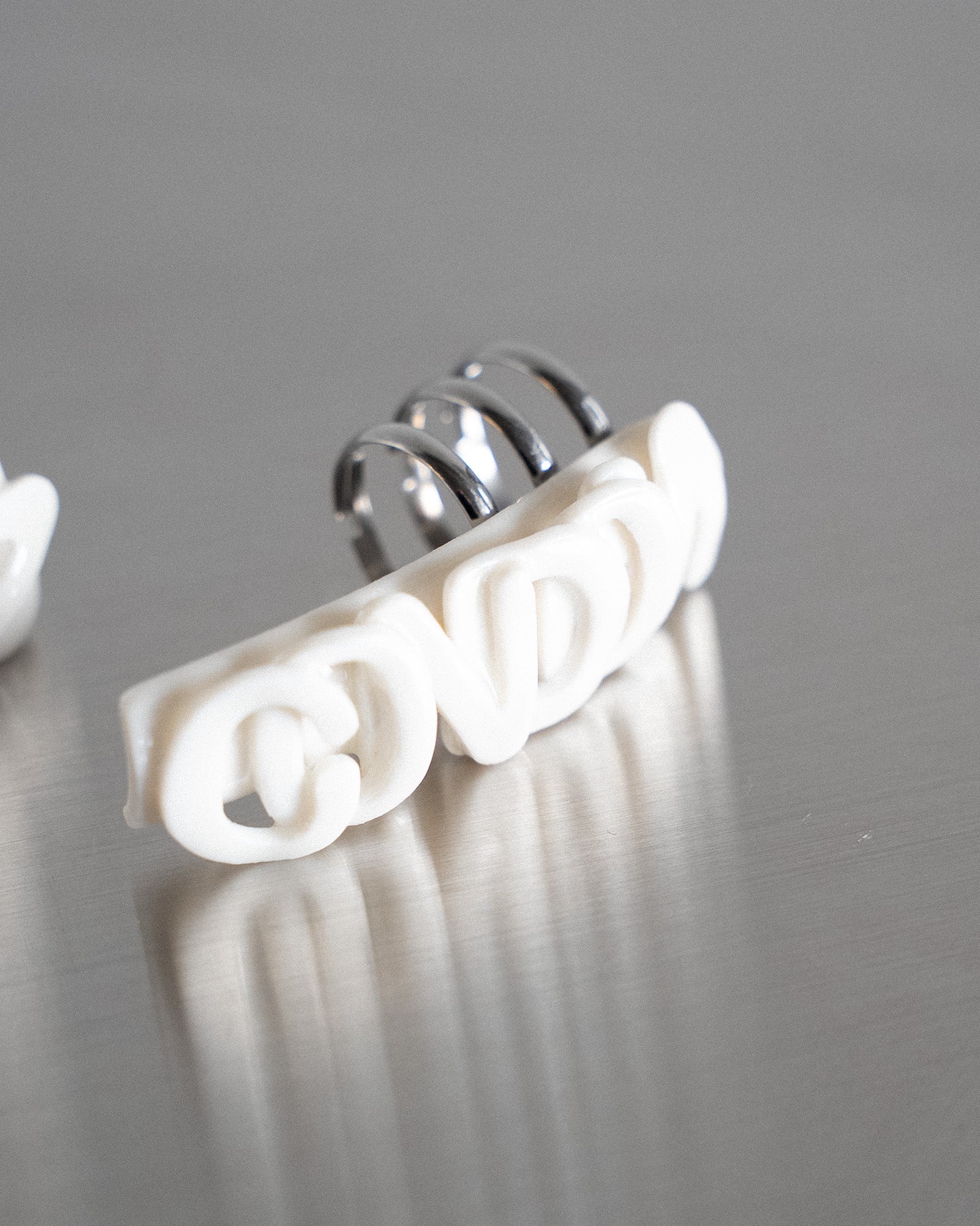 Porcelain Nail Ring “USE A / CONDOM Set” #1 (XL) by Fatma Cankaya